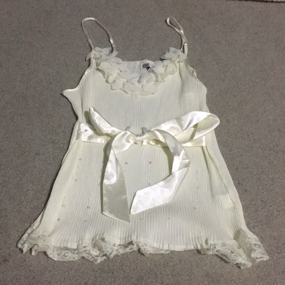 Light yellow little bedazzled tank top.